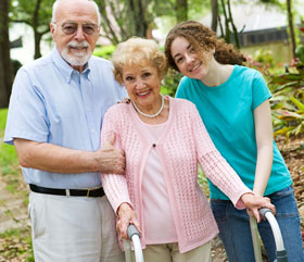Happy patient poses with her husband and granddaughter Happy patient poses with her husband and granddaughter