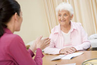 Woman receiving speech therapy Woman receiving speech therapy